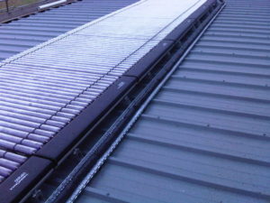 Evacuated tubes on composite roof